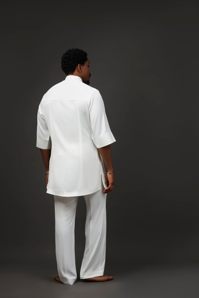 The Abuja man wearing Soso Africa Koles Collection charcoal kaftan — modern Nigerian designer menswear