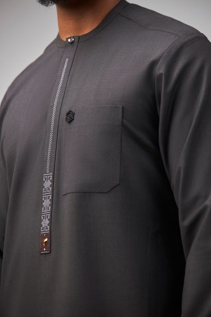 Alt-text: Grey Italian wool kaftan with understated embroidery and sharp tailoring — refined modern native wear for Abuja men.