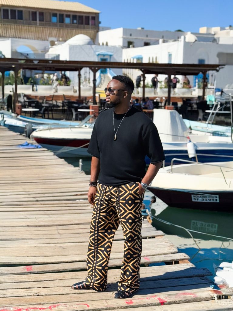 African tribal print pants styled with black tee – SOSO AFRICA Abuja cosmopolitan menswear.